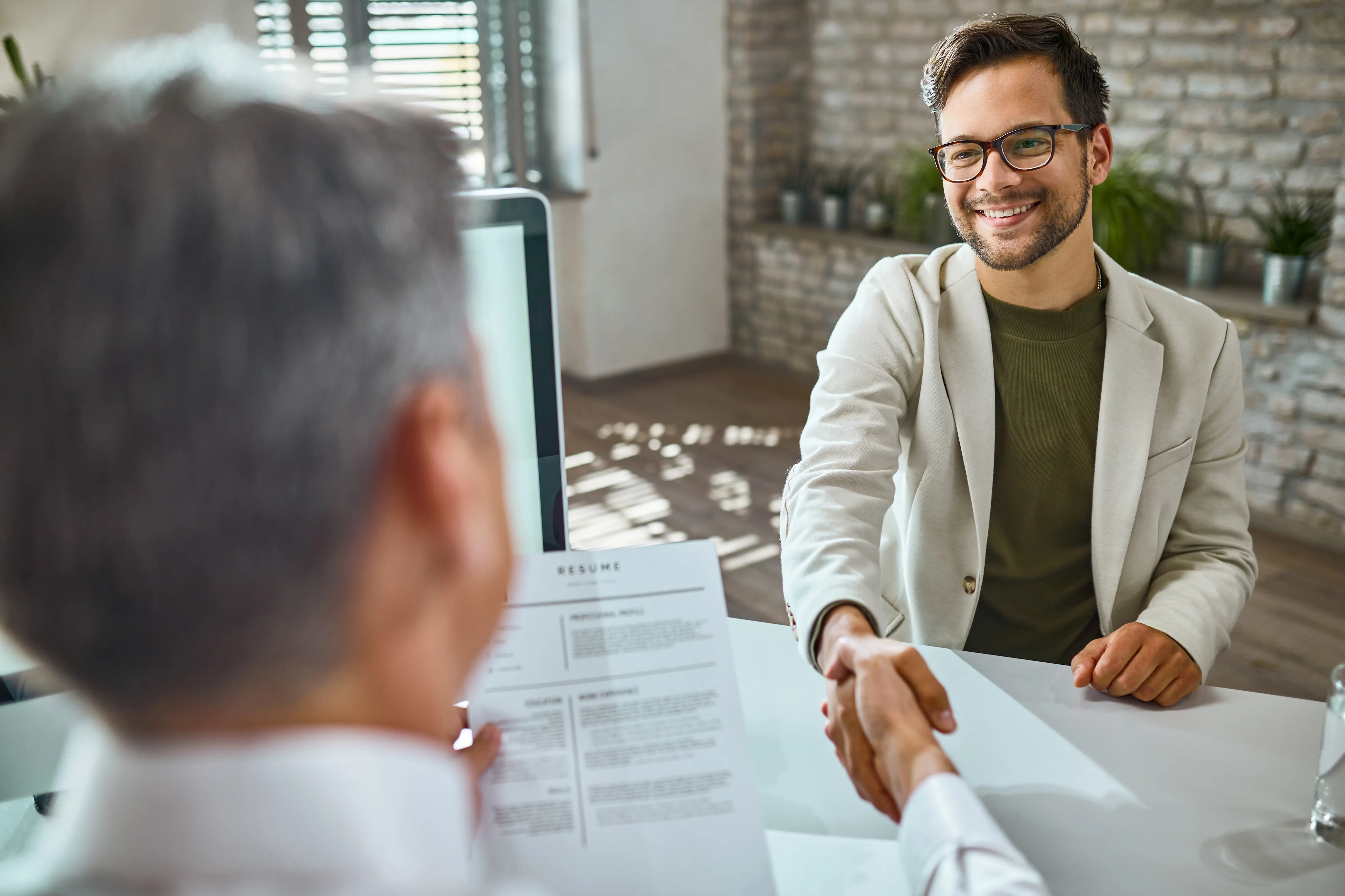 A person giving an interview and smiling